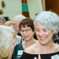 Gayle Schuab with guests at Enrichment.